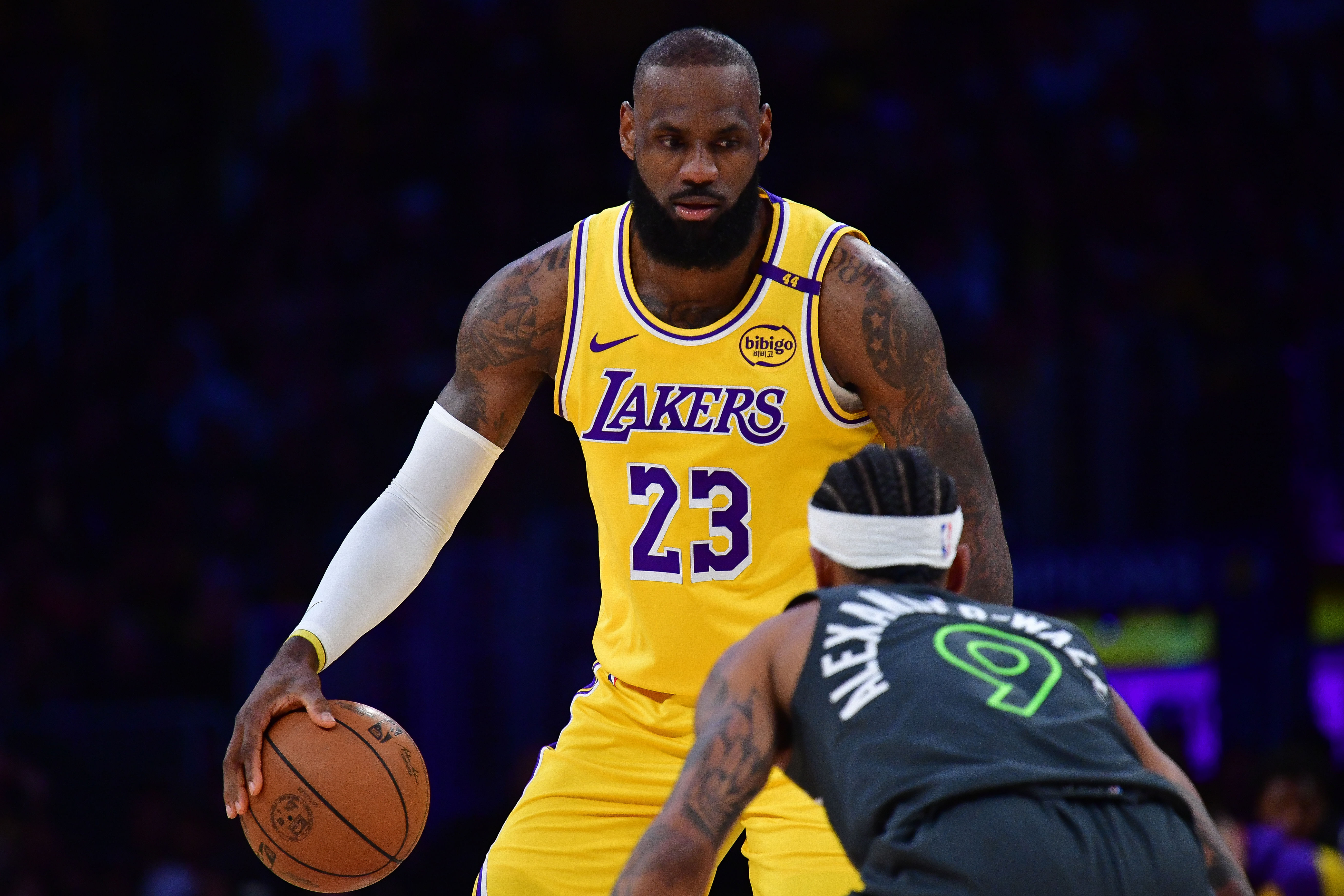 Los Angeles Lakers forward LeBron James (#23) controls the ball against Minnesota Timberwolves guard Nickeil Alexander-Walker (9) during the first half of their 2025 NBA playoff game. Photo: Imagn